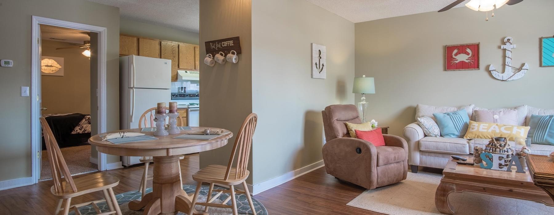 a living room with a table and chairs