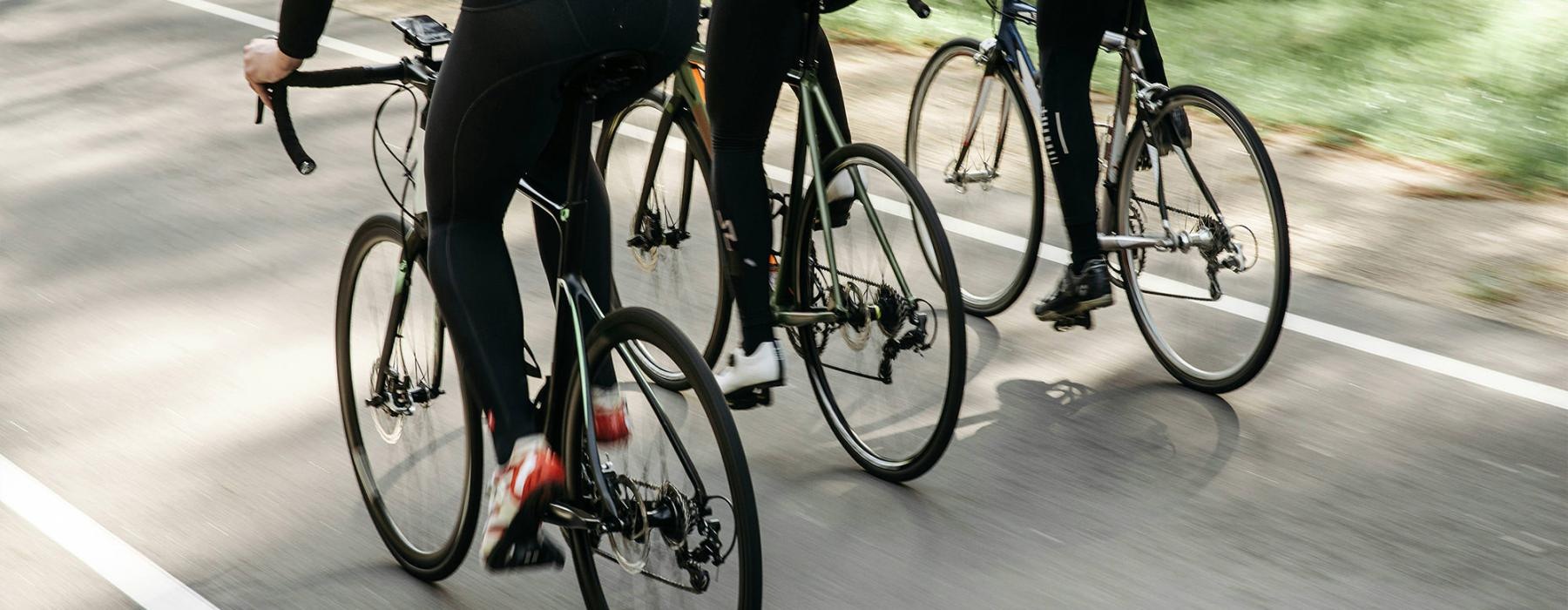 a group of people riding bikes