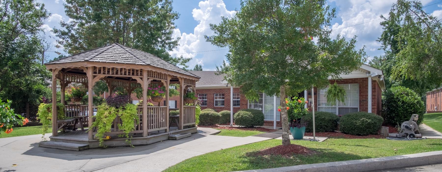 a pavilion with lush landscaping